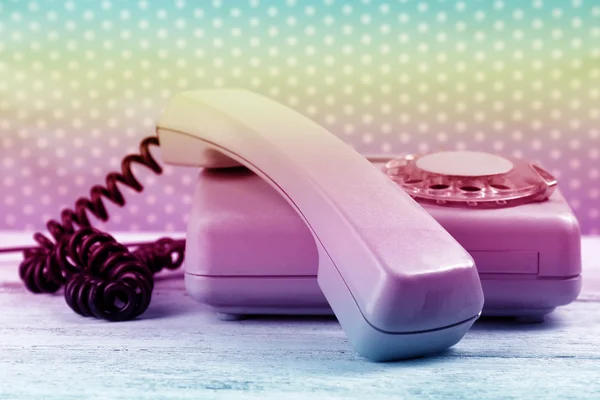 Retro turquoise telephone on wooden table — Stock Photo, Image