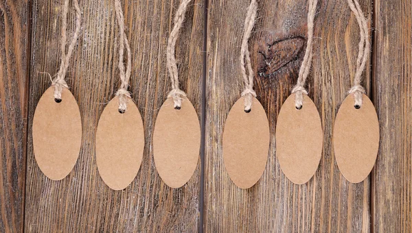 Brown tags on wood — Stock Photo, Image
