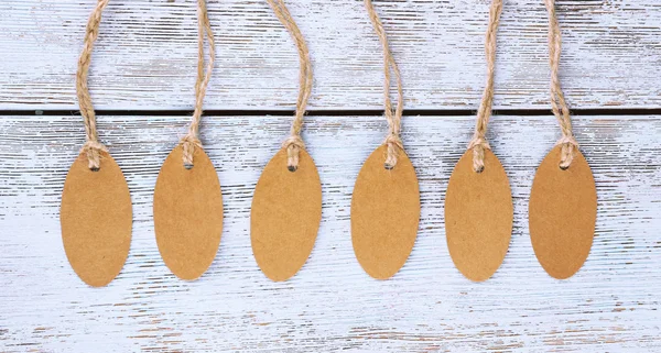 Brown tags on wood — Stock Photo, Image