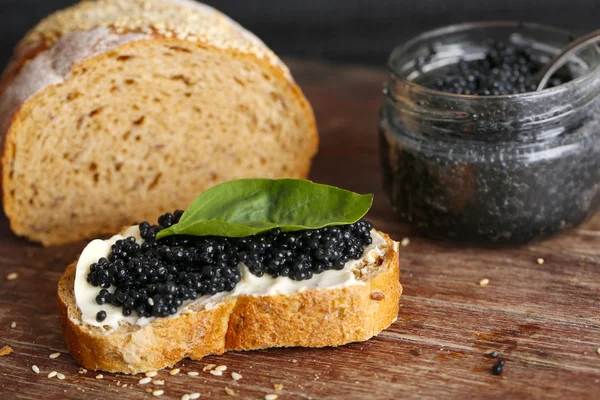 Butter and black caviar — Stock Photo, Image