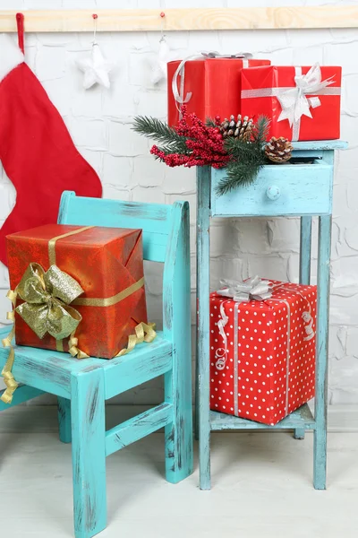 Christmas presents on blue chair — Stock Photo, Image