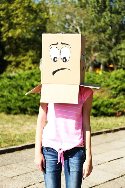 Woman with box on her head — Stock Photo, Image