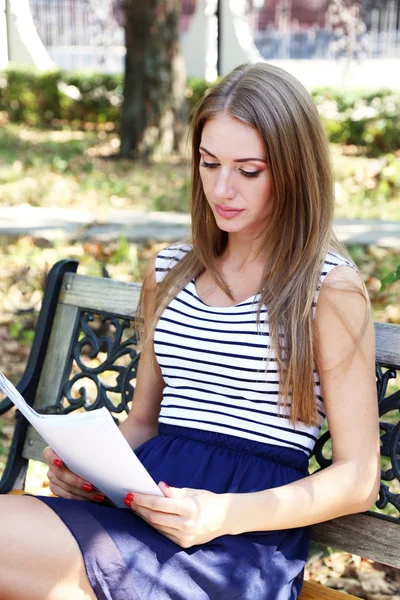 Beautiful young girl in dress outdoors — Stock Photo, Image