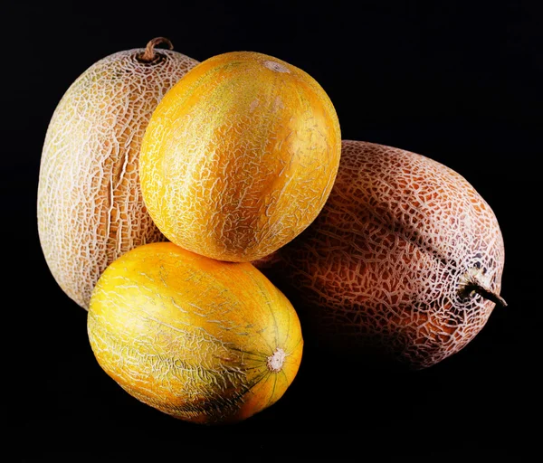 Melons isolated on black — Stock Photo, Image