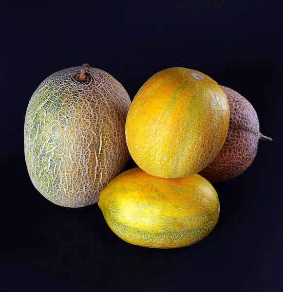 Meloner isolerade på svart — Stockfoto