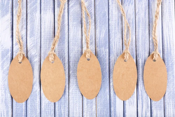 Brown tags on wood — Stock Photo, Image