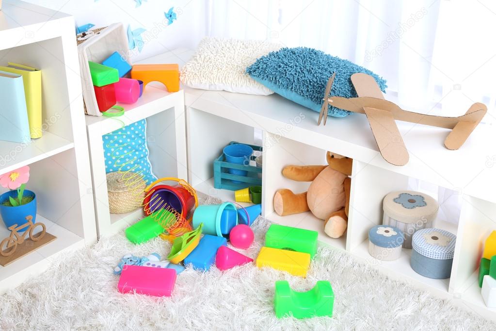 Toys on carpet in children room