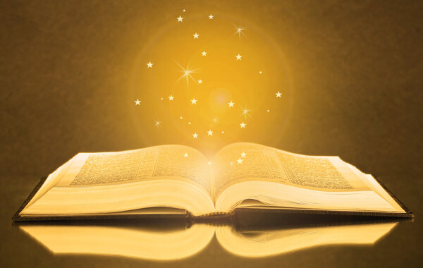 Magical book on bright background wit sparkles
