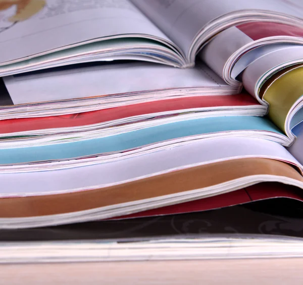 Magazines on wooden table — Stock Photo, Image