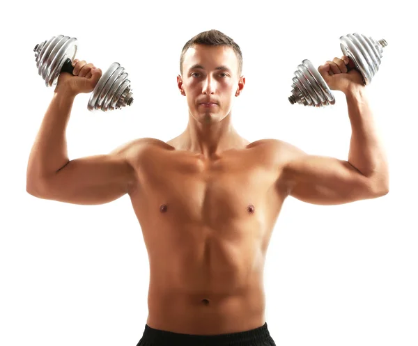 Guapo joven deportista muscular ejecutar ejercicio con mancuernas aisladas en blanco — Foto de Stock