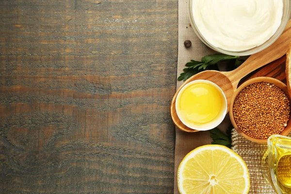 Mayonnaise ingredients on wooden background — Stock Photo, Image