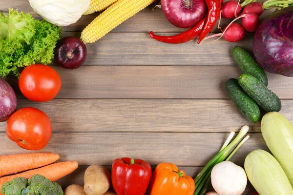 Fresh organic vegetables on wooden background — Stock Photo, Image