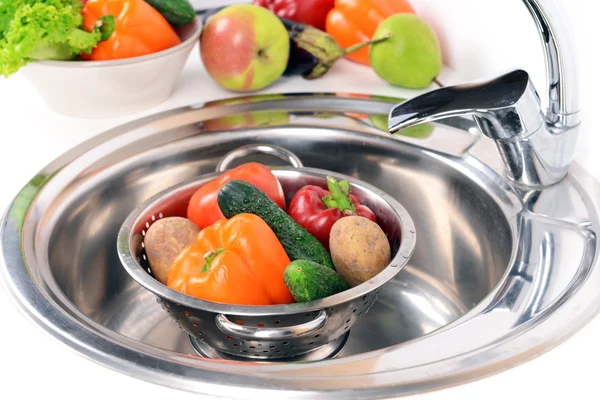 Washing fruits and vegetables close-up