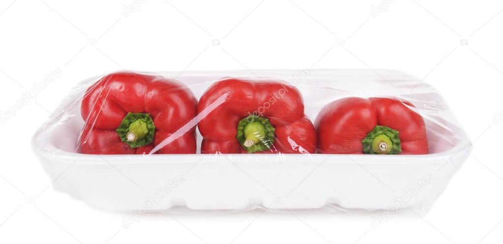 Pepper packed in food film isolated on white 