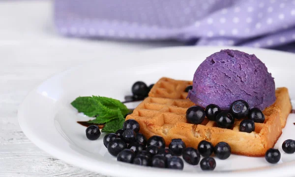 Tasty belgian waffles with ice cream on wooden table — Stock Photo, Image