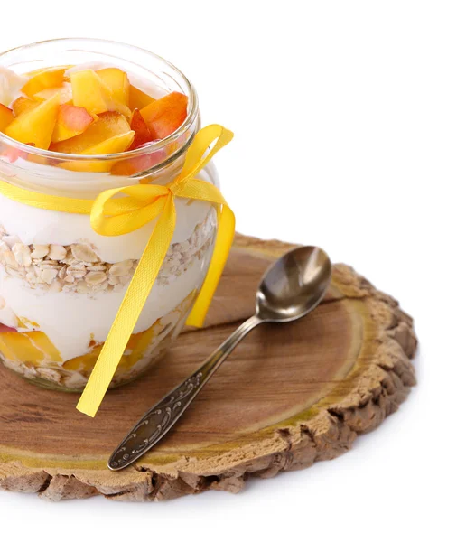 Healthy breakfast - yogurt with  fresh peach and muesli served in glass jar on wooden tray, isolated on white — Stock Photo, Image