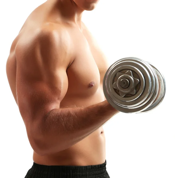 Handsome young muscular sportsman execute exercise with dumbbells isolated on white — Stock Photo, Image