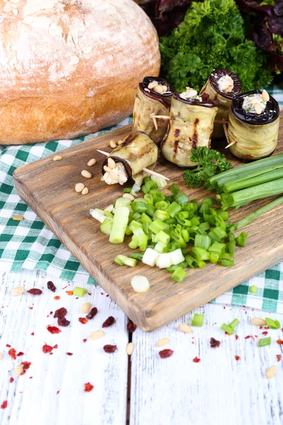 Fried aubergine with cottage cheese, parsley and bread on wooden background — Stock Photo, Image