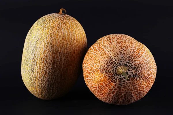 Melons isolated on black — Stock Photo, Image