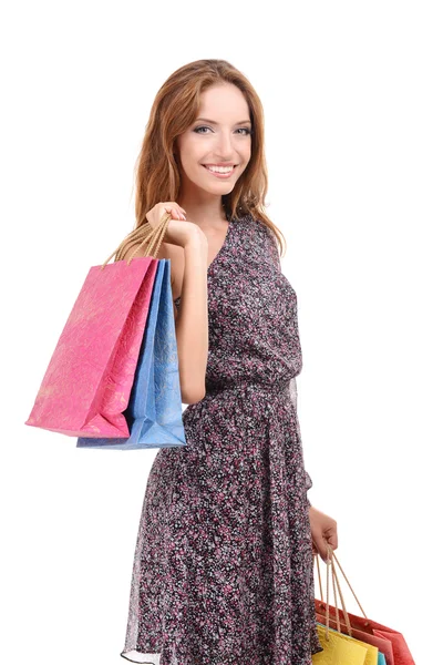 Vacker ung kvinna med shoppingväskor isolerade på vitt — Stockfoto