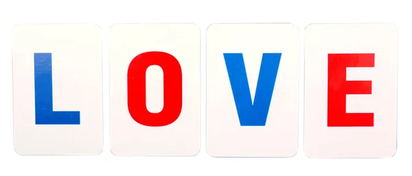 Αγάπη λέξη σχηματίζεται από εκπαιδευτικό χάρτινες κάρτες που απομονώνονται σε λευκό — Φωτογραφία Αρχείου