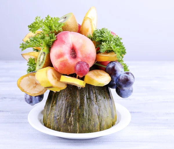 Table decoration made of fruits on grey wooden table on light background — Stock Photo, Image