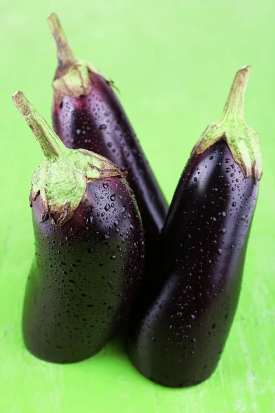 Aubergines on green — Stock Photo, Image