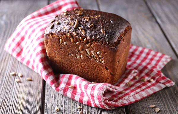 Fresh bread on wooden table, close up — Stock Photo, Image