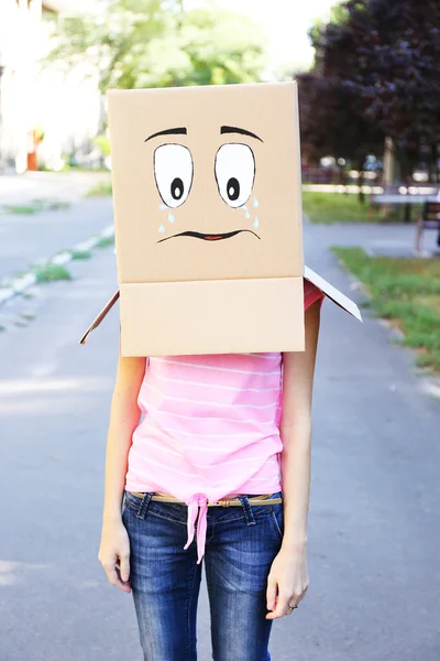 Woman with box on head — Stock Photo, Image