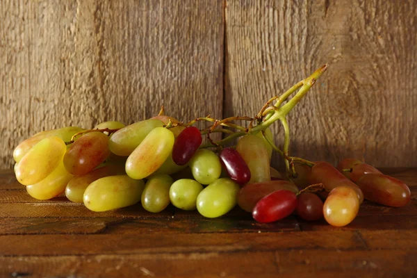 Grape on wooden background — Stock Photo, Image
