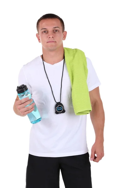 Handsome young sportsman holding towel and bottle with water isolated on white — Stock Photo, Image