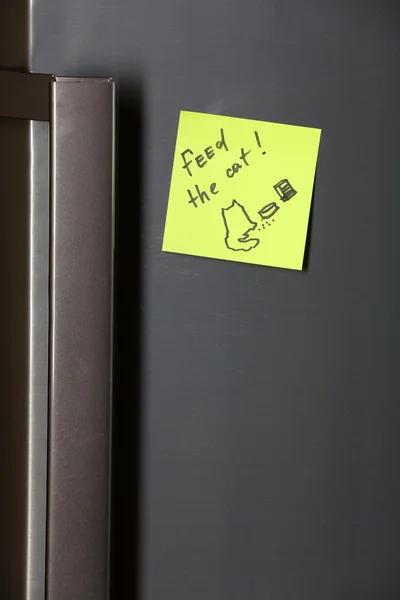 Note on piece of paper on refrigerator closeup — Stock Photo, Image