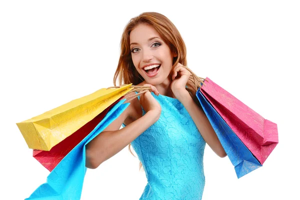 Belle jeune femme avec des sacs à provisions isolés sur blanc — Photo