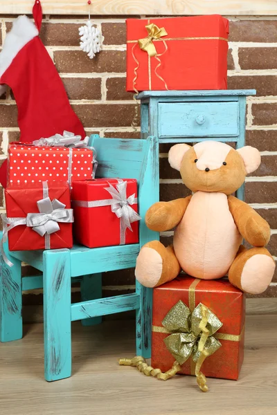 Christmas presents on chair — Stock Photo, Image
