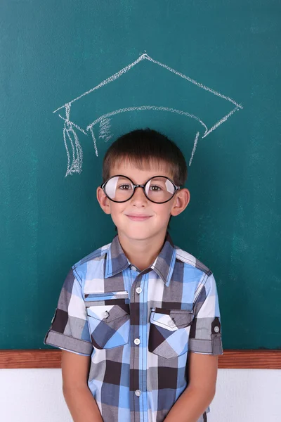 Funny Schoolboy at blackboard — Stock Photo, Image