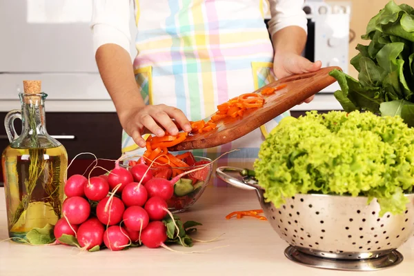 Woman cooking vegetable salad — Stock Photo, Image