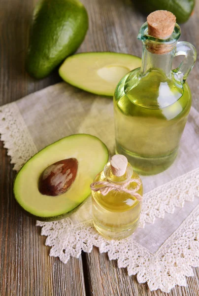 Avocado oil on table close-up — Stock Photo, Image