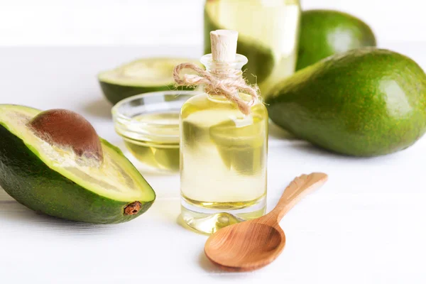 Avocado oil on table close-up — Stock Photo, Image