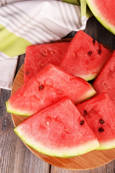 Slice of watermelon on wooden table — Stock Photo, Image