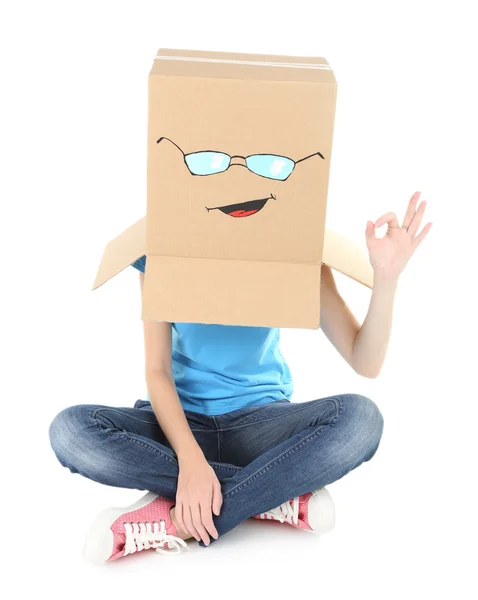 Woman with cardboard box on her head with happy face, isolated on white — Stock Photo, Image