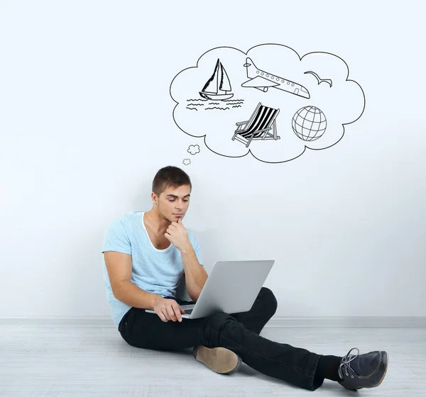 Guy sitting on floor in room — Stock Photo, Image