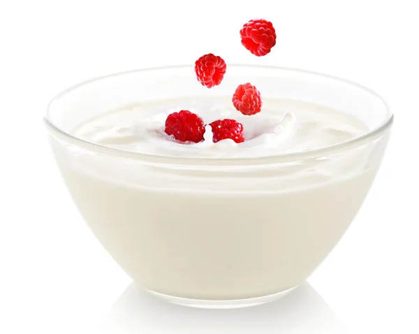 Delicious fresh raspberry falling into bowl of yogurt isolated on white — Stock Photo, Image