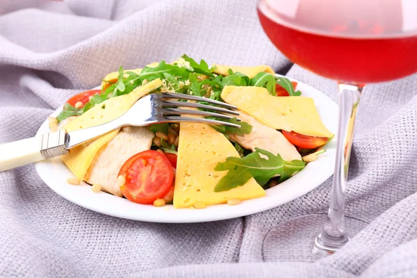 Fresh salad with arugula on fabric background — Stock Photo, Image