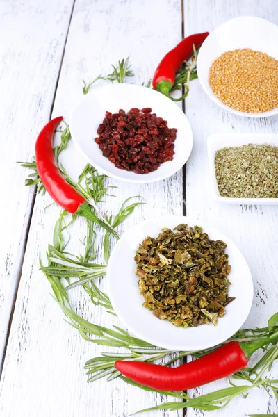 Spice with herbs and dried chilly pepper on wooden background — Stock Photo, Image