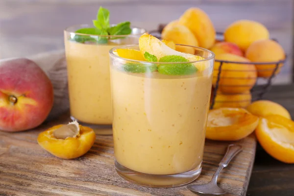 Apricot dessert in glasses on table close-up — Stock Photo, Image