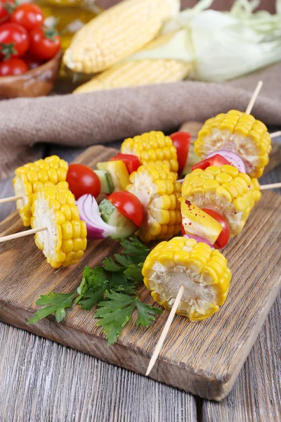 Sliced vegetables on picks on board on table close-up — Stock Photo, Image