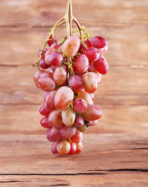 Bunch of grape on wooden background — Stock Photo, Image