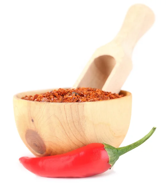 Milled red chili pepper in wooden bowl isolated on white — Stock Photo, Image