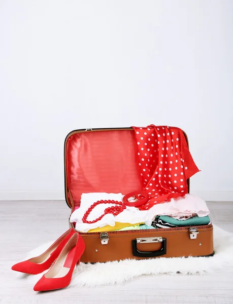 Female clothes in old suitcase — Stock Photo, Image