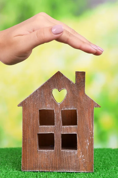 Small house and hand — Stock Photo, Image
